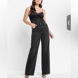 In like-new condition High Waisted Washed Black Wide Leg Jeans in size 4